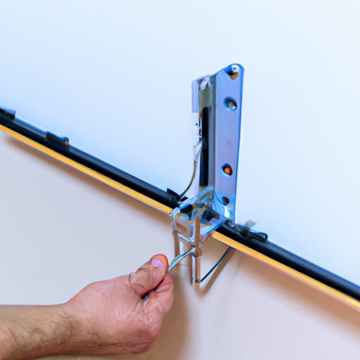 Hook the TV onto the Mounting Bracket